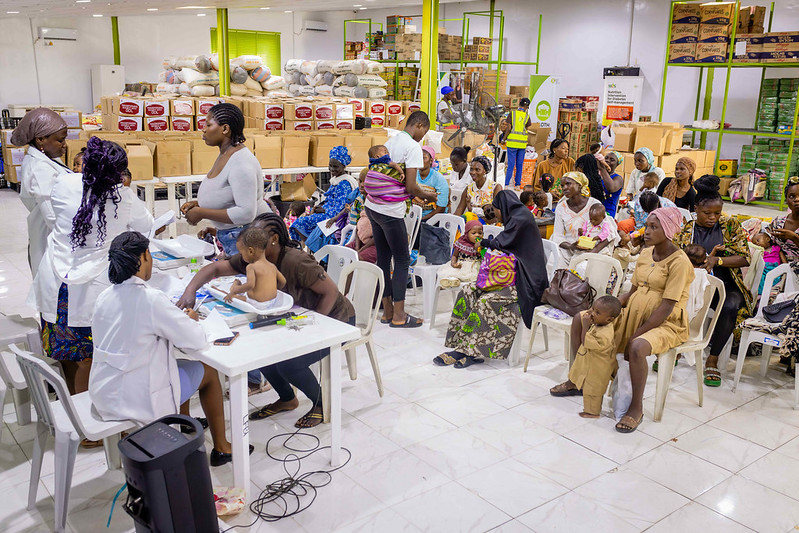 Nurses Mopelola Oladapo and Banjo Bukola conduct medical checkup for babies at the Nutritious Meal Plan Intervention Program for Vulnerable Mothers & Children (NUMEPLAN) at the Lagos Food Bank Initiative facility. (Photo: The Global FoodBanking Network, Julius Ogundiran)